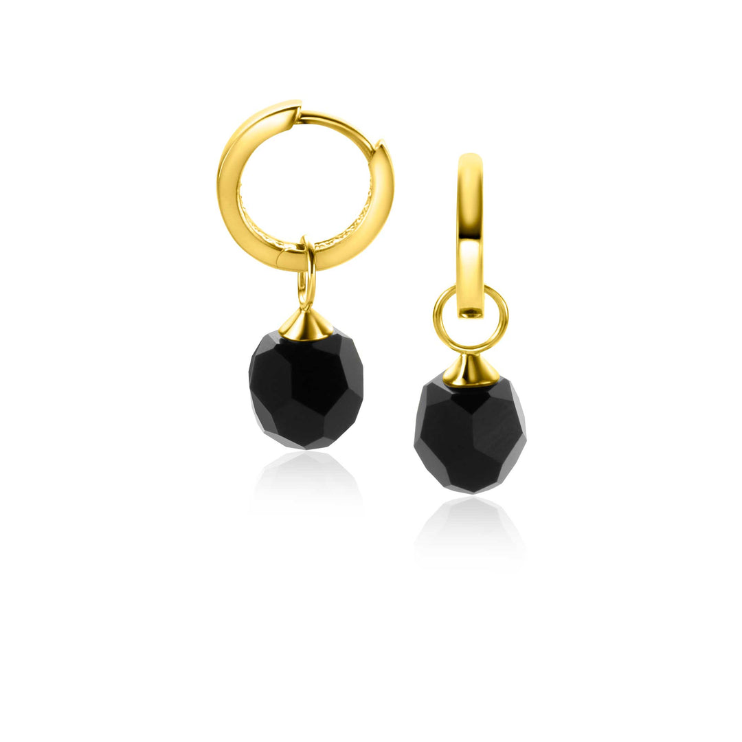 De Zinzi Oorbellen Goud ZGCH144 Z zijn gouden creolen met bungelende zwarte facetstenen die elegantie toevoegen. Hun gladde, glanzende afwerking wordt aangevuld met zwarte achthoekige kralen, perfect voor degenen die op zoek zijn naar Zinzis verfijnde stijl.