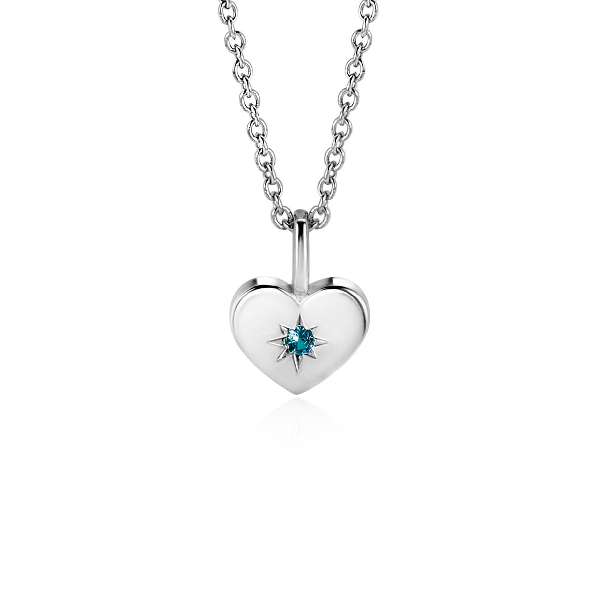 Pendentif en forme de cœur en argent avec une pierre précieuse bleue.