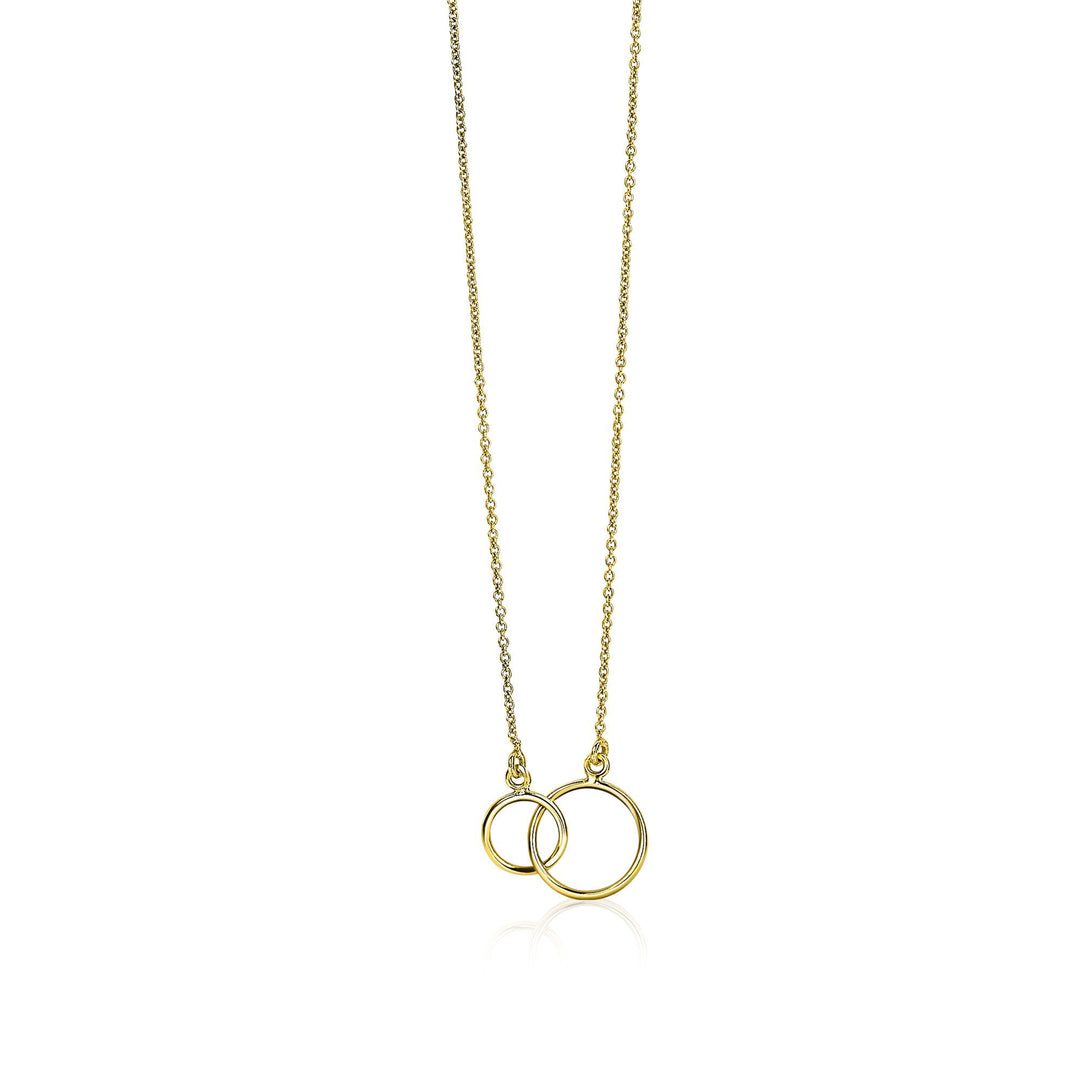 De Zinzi Ketting Goud Zgc115 is een elegante gouden ketting met twee in elkaar grijpende ringen aan een delicate ketting. Met de grotere ring die de kleinere sierlijk overlapt, beide vervaardigd in een glanzende afwerking, vangt dit minimalistische ontwerp de essentie van Kettingen voor tijdloze verfijning.