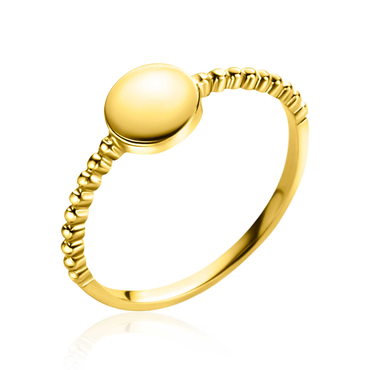 Bague en or avec un design lisse et un anneau texturé.