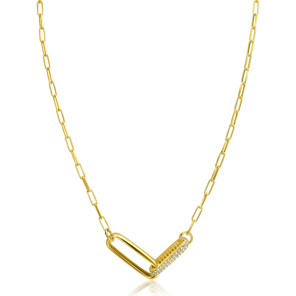 Collier doré avec un pendentif en forme de cœur orné de zircons.