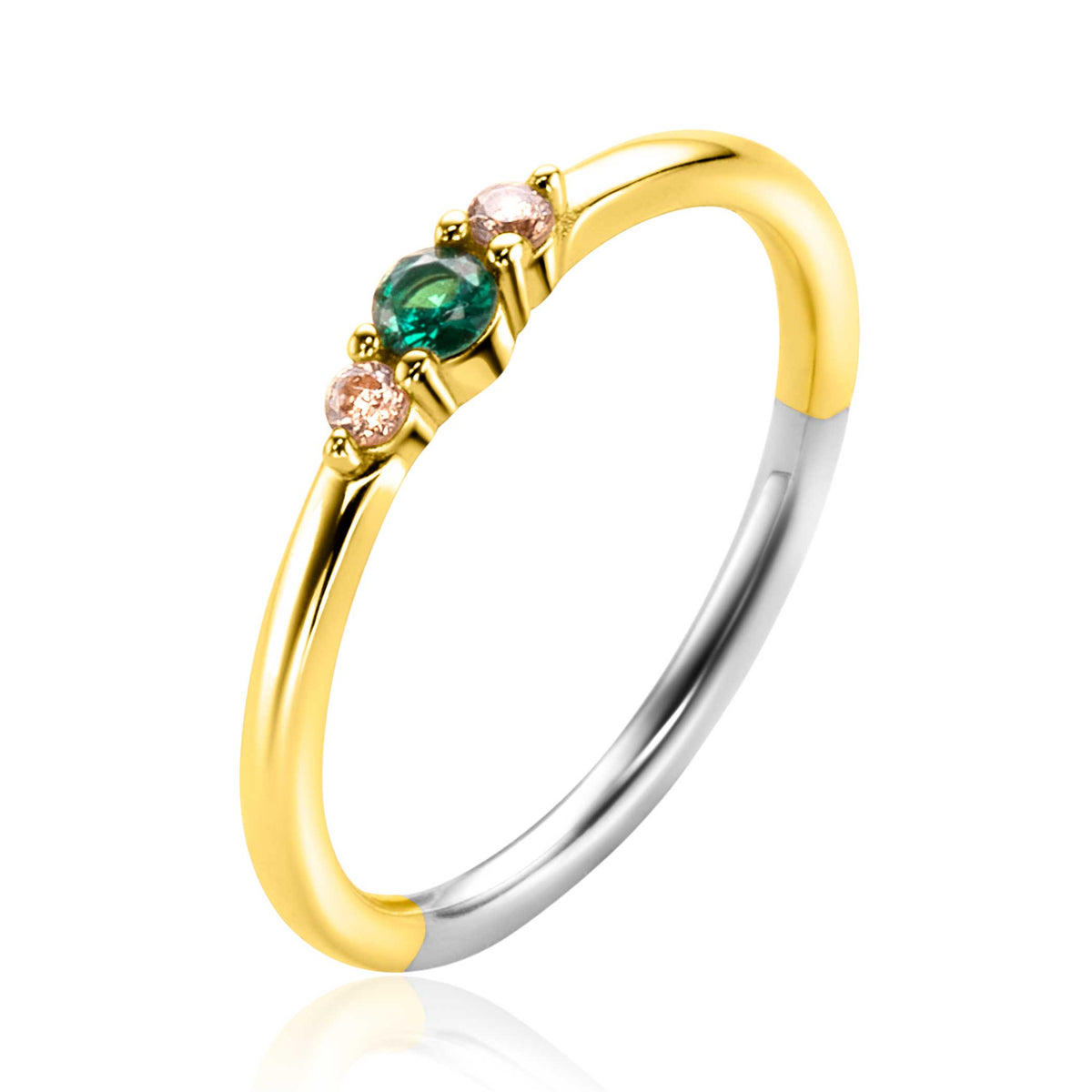 Bague dorée avec trois pierres précieuses, dont une verte et deux roses.