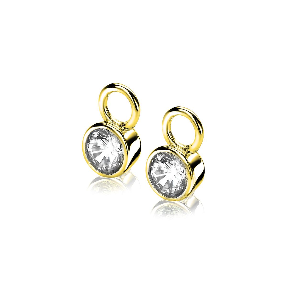 Boucles d'oreilles dorées avec un cristal transparent, forme ronde et finition brillante.
