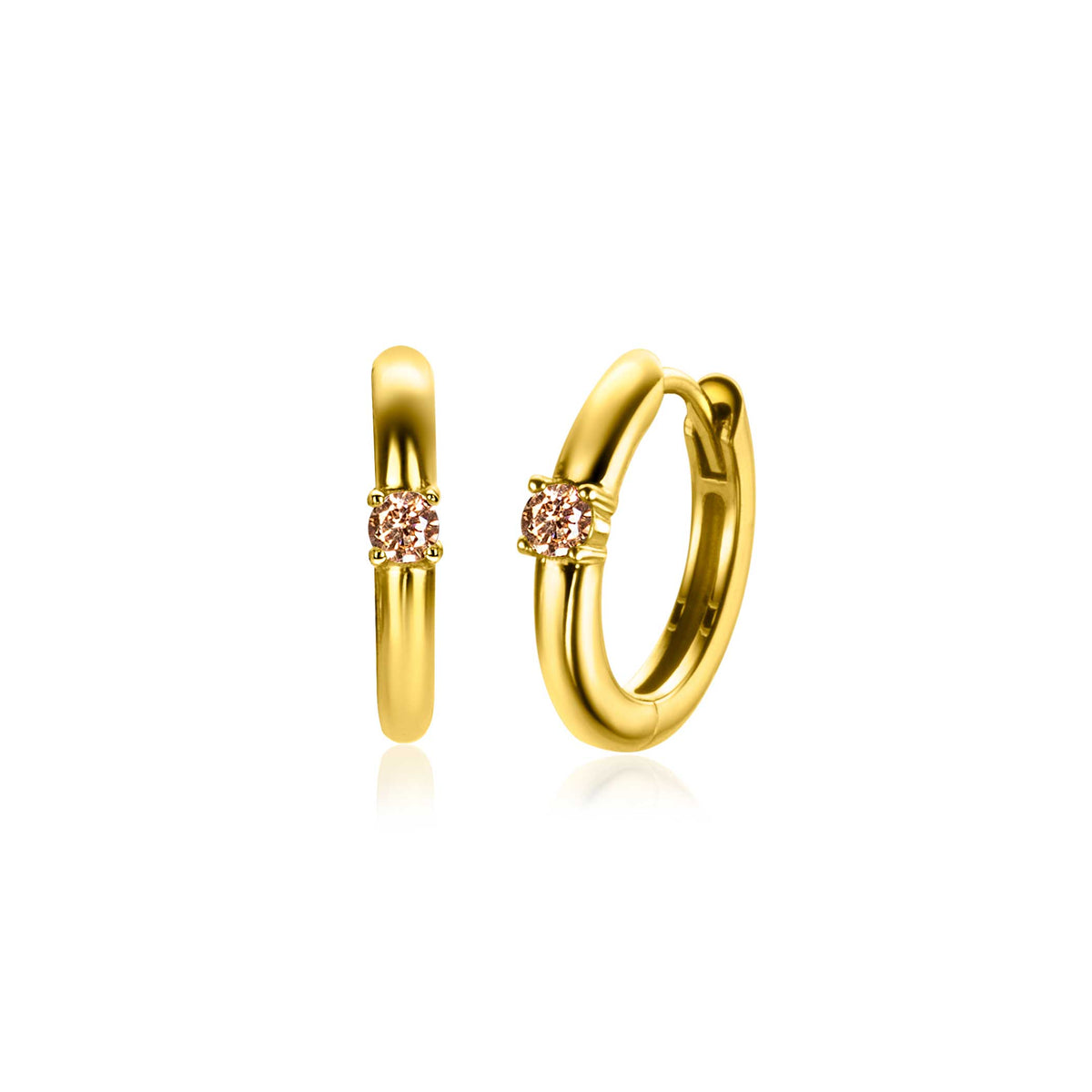 Boucles d'oreilles dorées avec un détail en cristal rose.