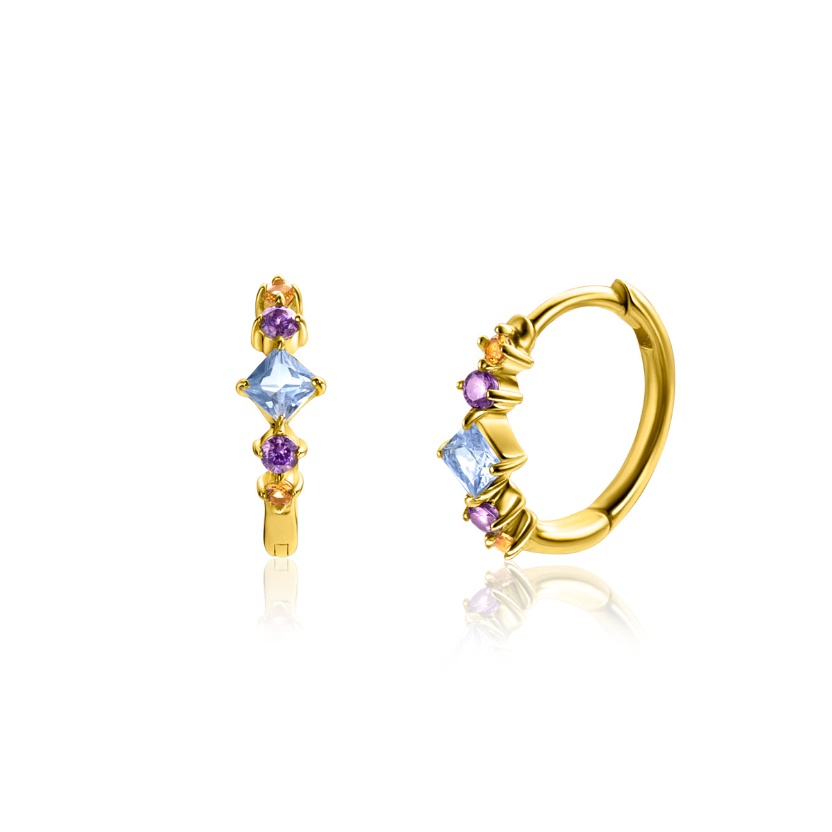 Boucles d'oreilles plaquées or avec des pierres précieuses bleues et violettes.