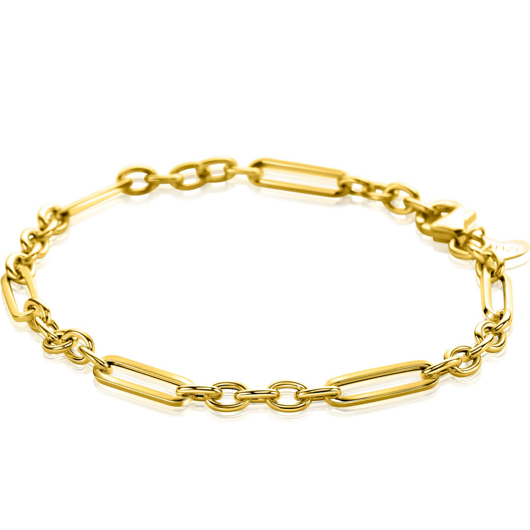 Maak kennis met de Zinzi Armband Goud Zga473, een delicate armband met een prachtig patroon van afwisselende langwerpige ovale en ronde schakels. Dit elegante ontwerp belichaamt de tijdloze paperclip-schakelstijl, perfect voor elke gelegenheid.