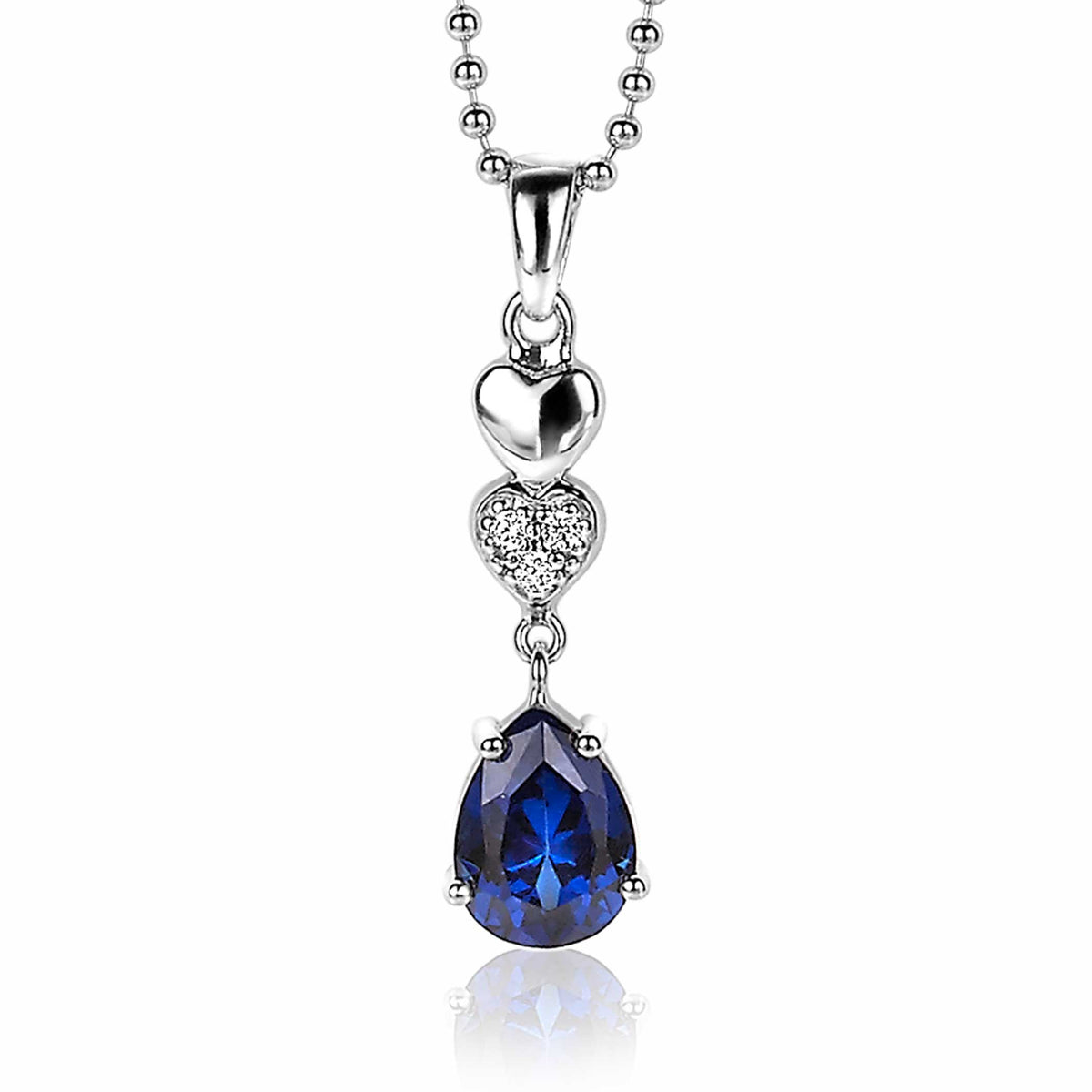 Pendentif en argent avec un cœur et une pierre en forme de poire bleue.