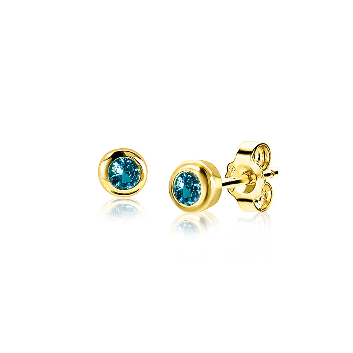 Boucles d'oreilles dorées avec un cristal bleu en forme de rond.