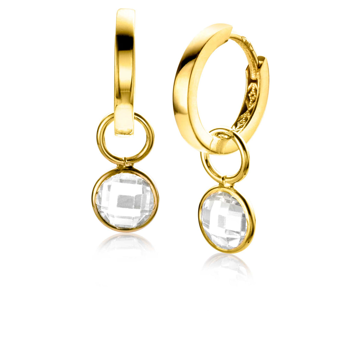 Boucles d'oreilles dorées avec un pendentif en cristal transparent.