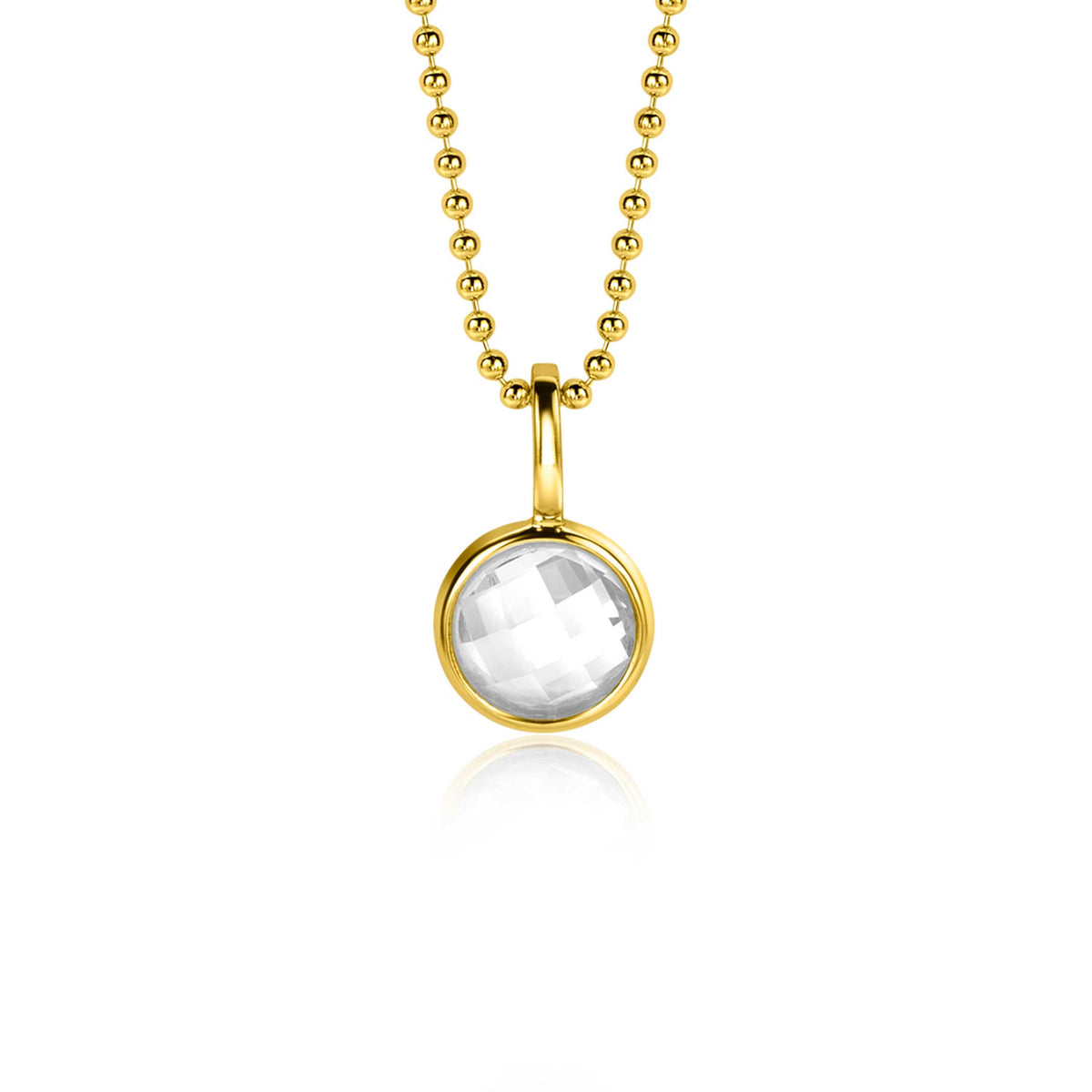 Pendentif doré avec une pierre transparente, suspendu à une chaîne à billes.
