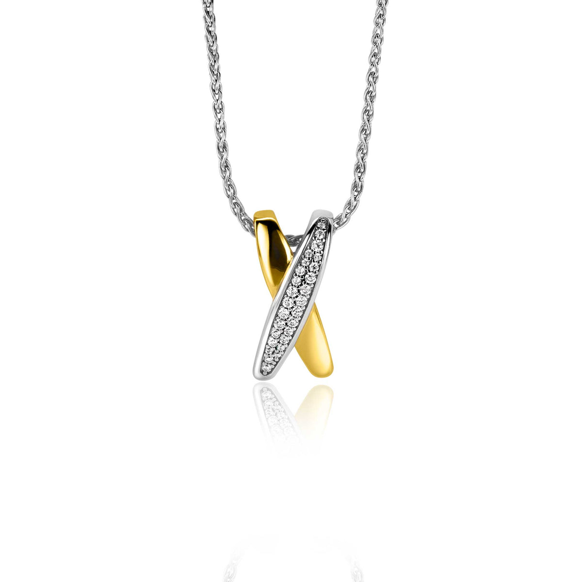 Pendentif doré et argenté en forme de croix, orné de zircons.