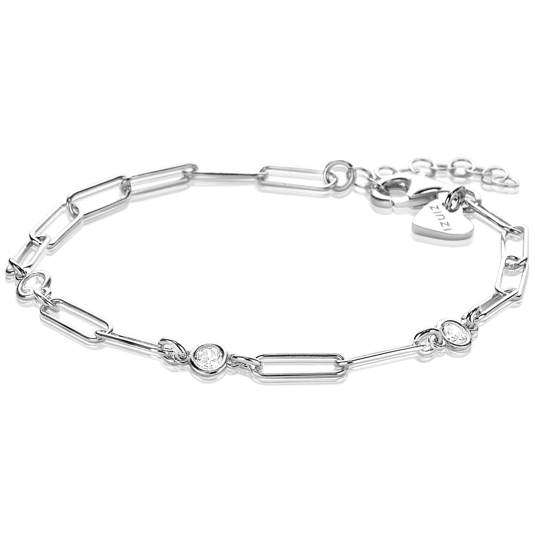 De Zinzi Armband Zilver Zia2079 van Zinzi heeft een modern design met afwisselende langwerpige paperclipschakels en ronde zirkonia-steenzettingen, aangevuld met een hartvormig label bij de sluiting voor een elegante touch.