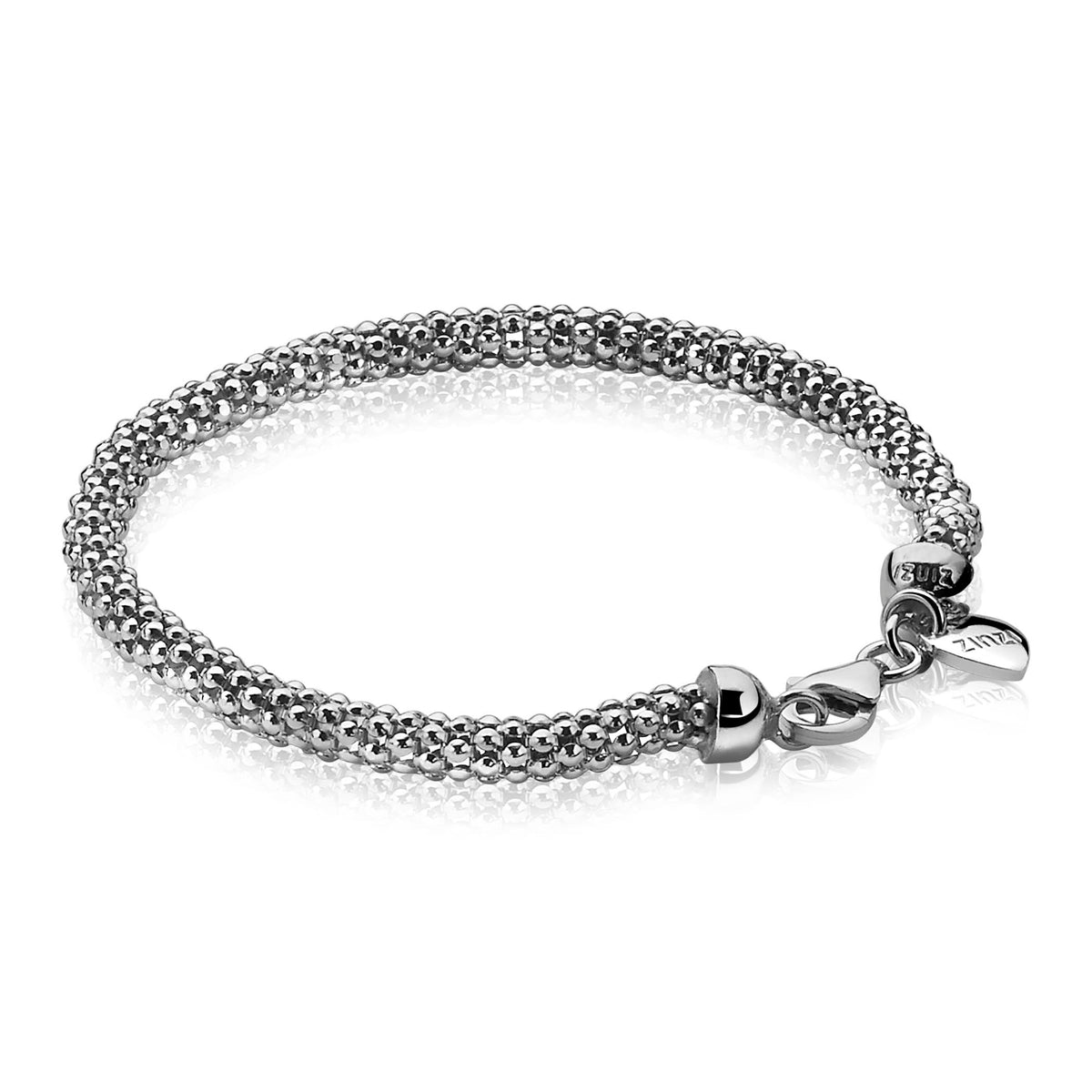 Bracelet en argent avec un design en mailles et fermoir en boule.