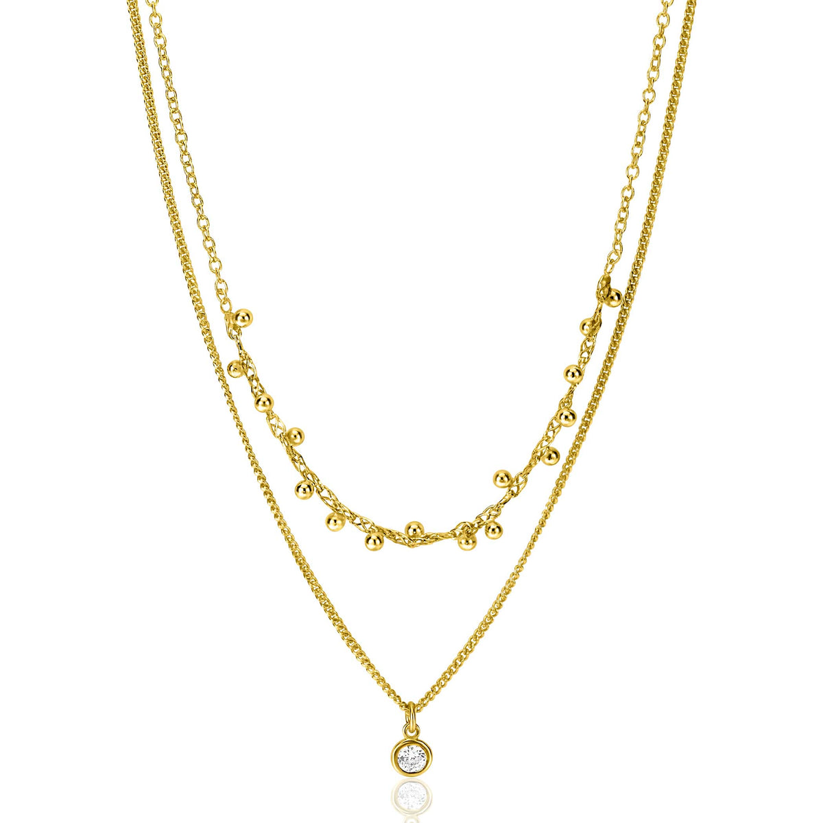 Collier doré à deux chaînes avec des petites boules et un pendentif brillant.