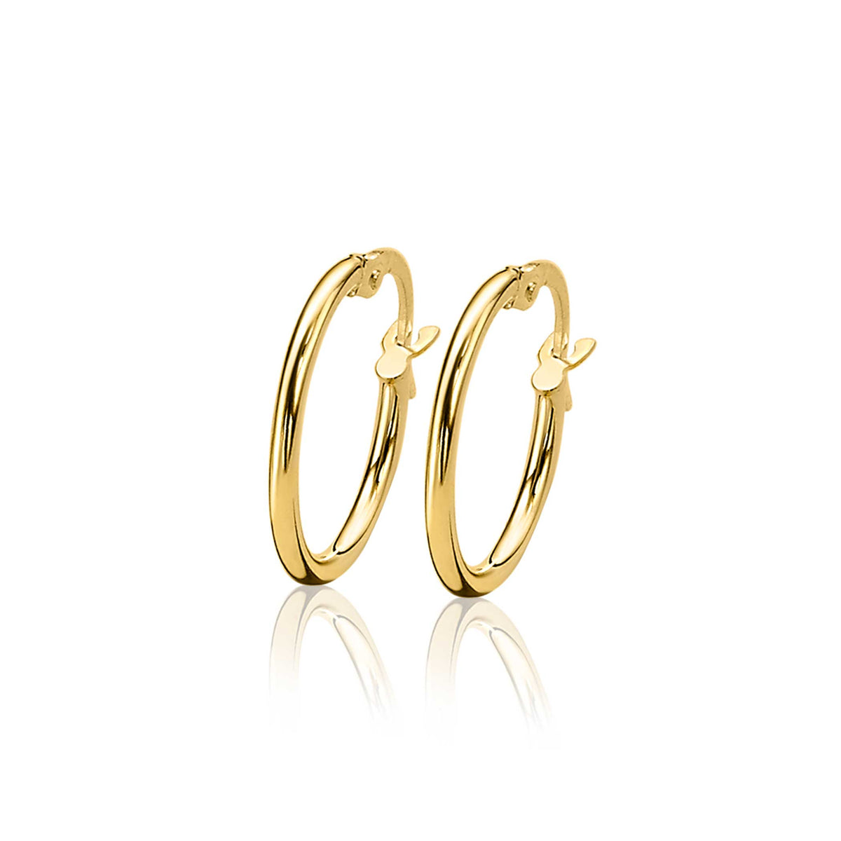 Boucles d'oreilles en or avec un design circulaire et un détail en forme de cœur.