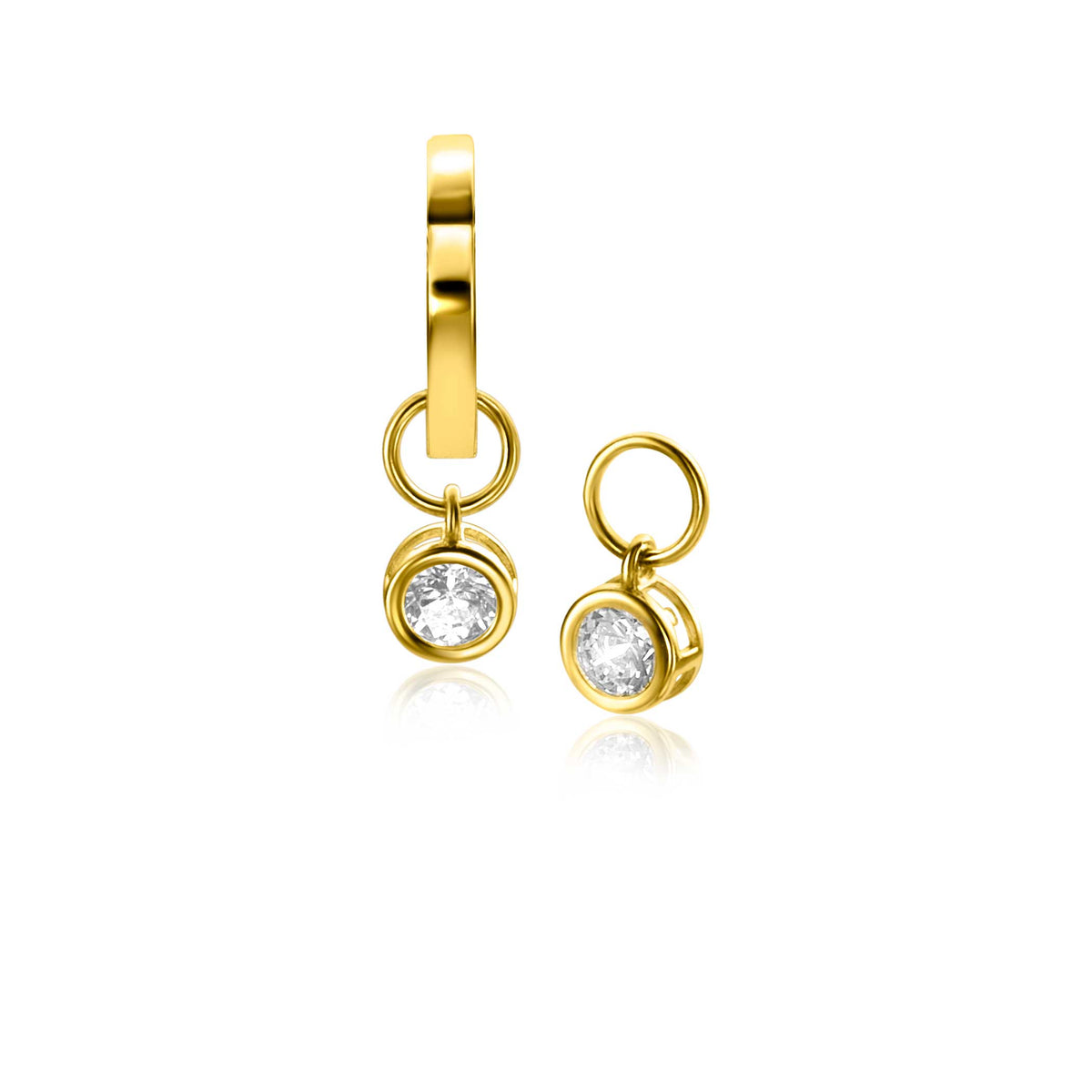 Boucles d'oreilles en or avec un pendentif rond et un cristal transparent.