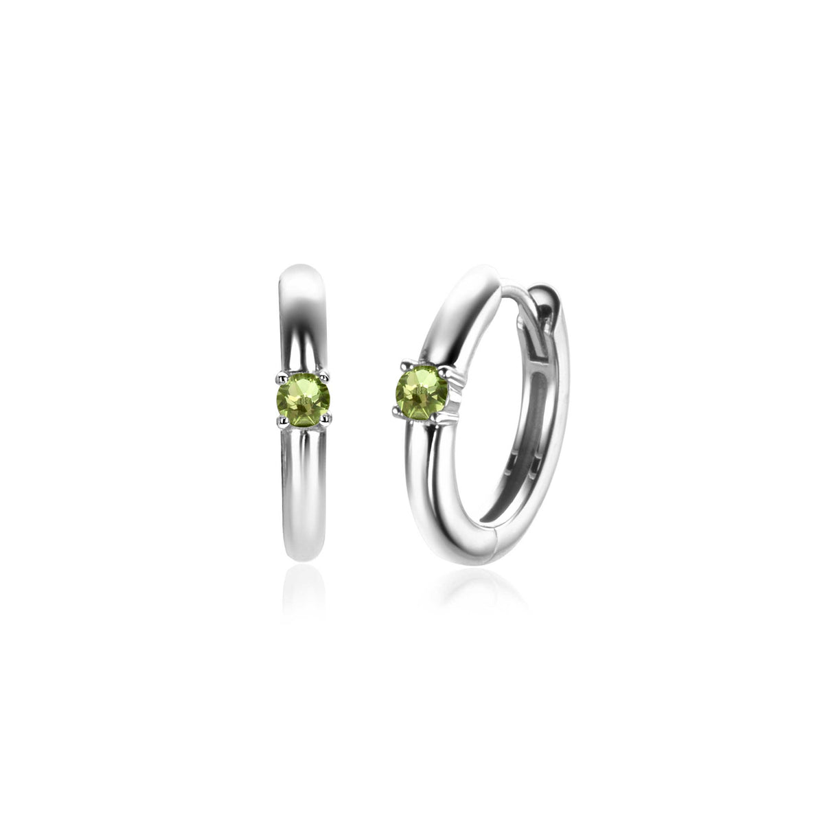 Boucles d'oreilles en argent avec un zircon vert, forme ronde et finition lisse.