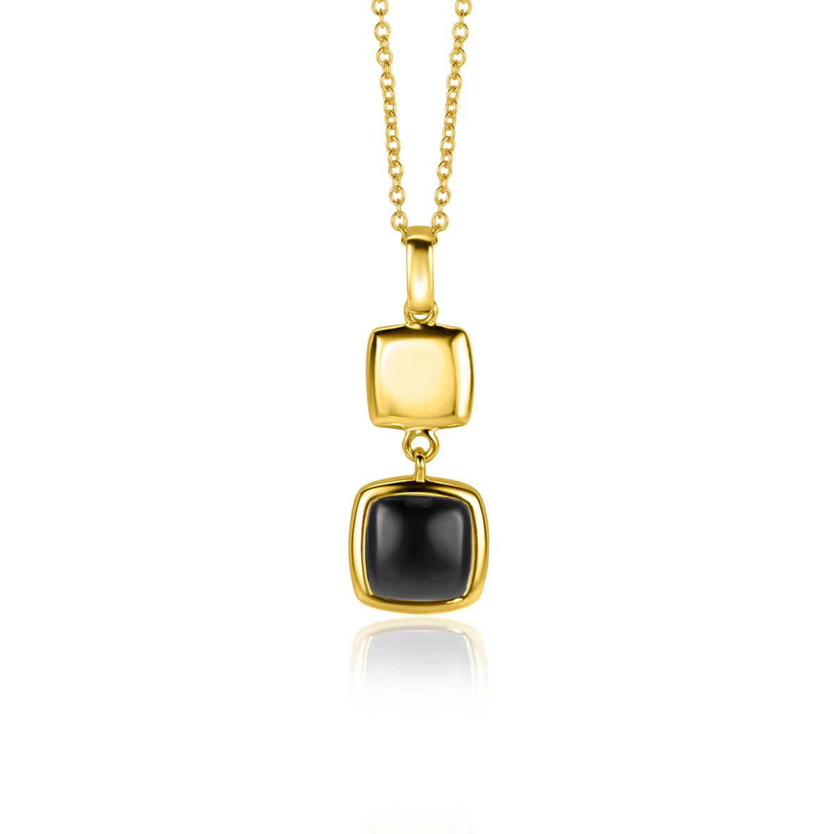 Pendentif doré avec deux formes carrées, l'une noire et l'autre dorée, suspendu à une chaîne.