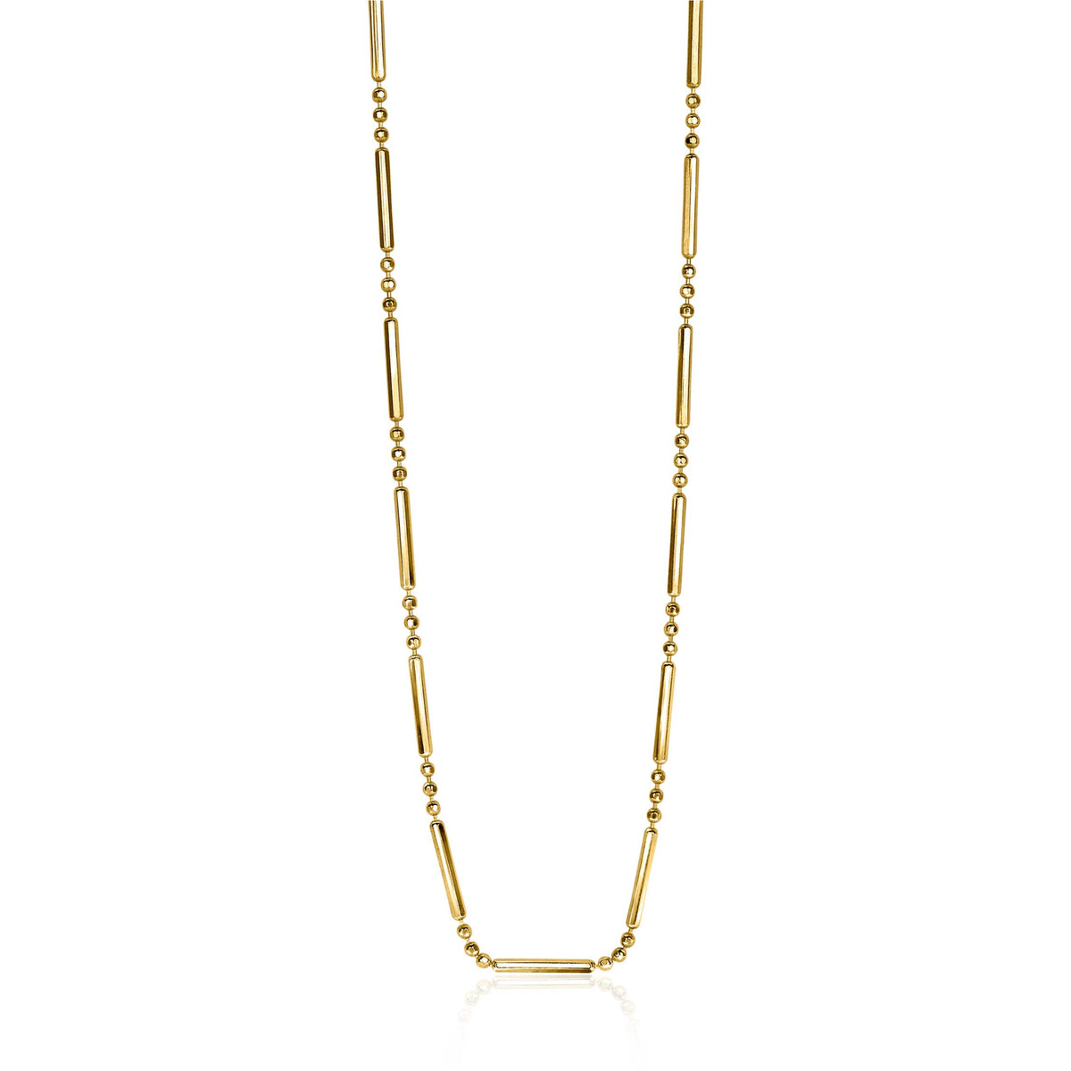 Collier doré avec des éléments allongés et des perles rondes.