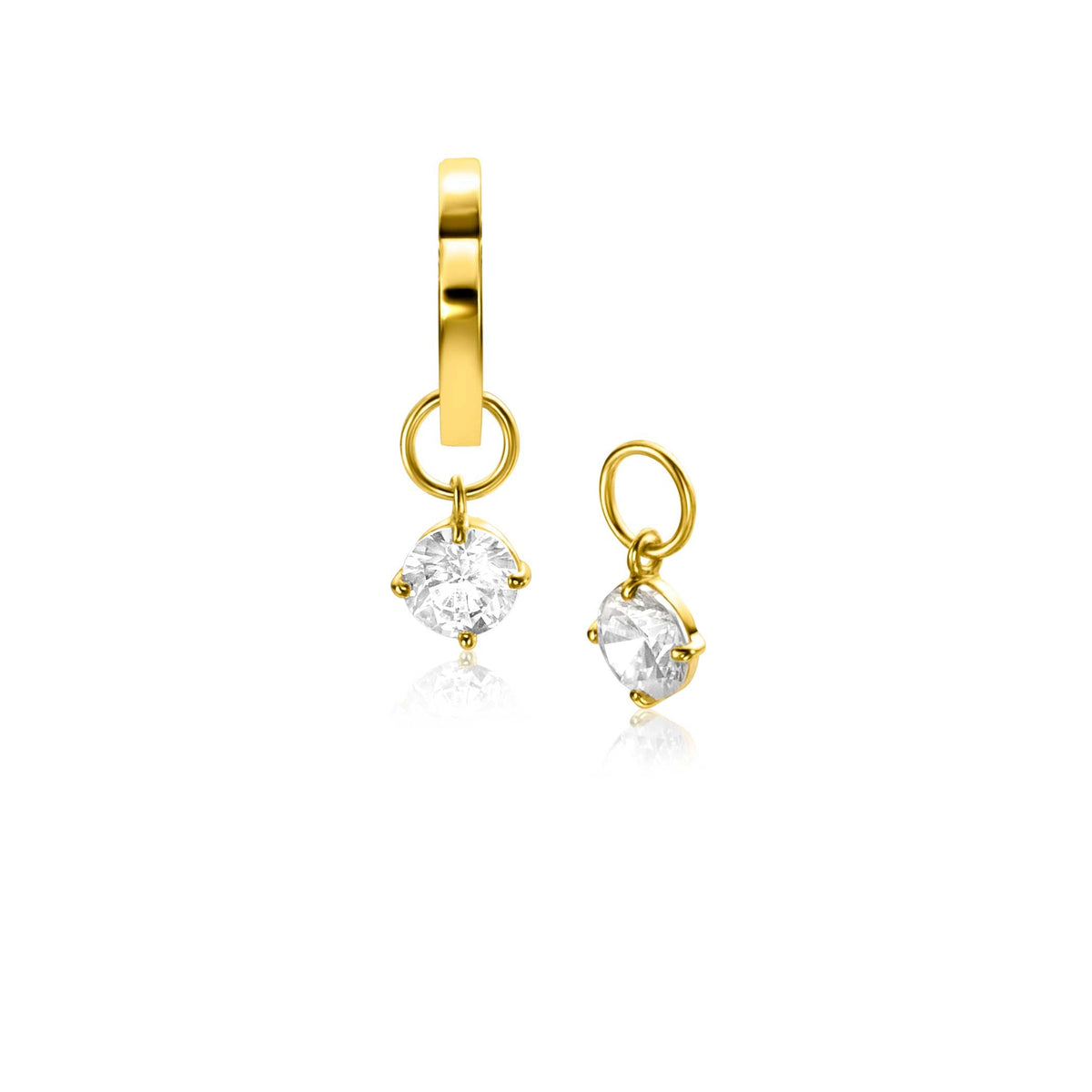 Boucles d'oreilles en or avec un pendentif en forme de diamant transparent.