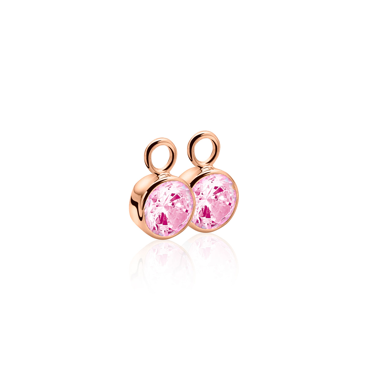 Boucles d'oreilles dorées avec des pierres roses rondes.