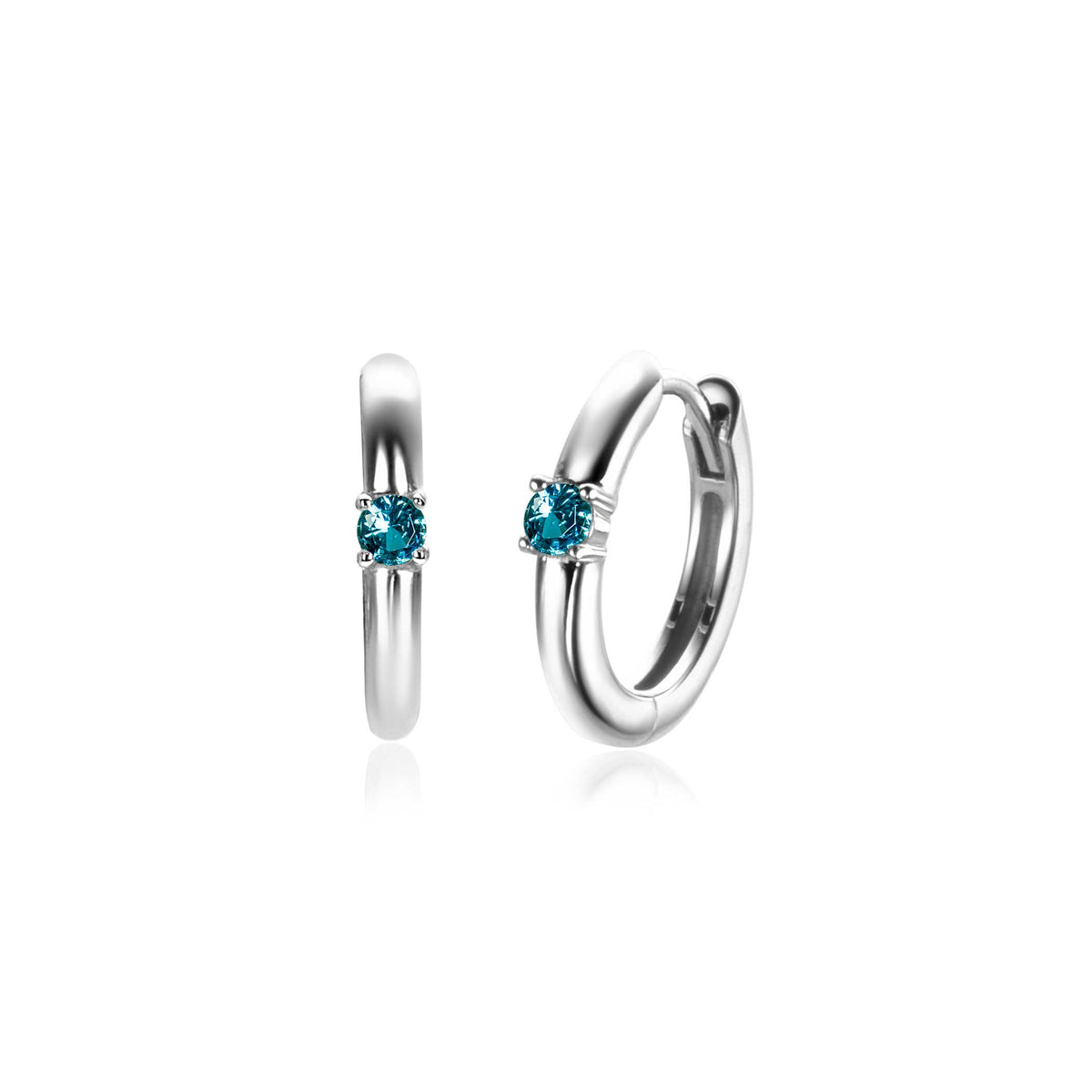 Boucles d'oreilles en argent avec un zircon bleu, forme ronde et finition brillante.