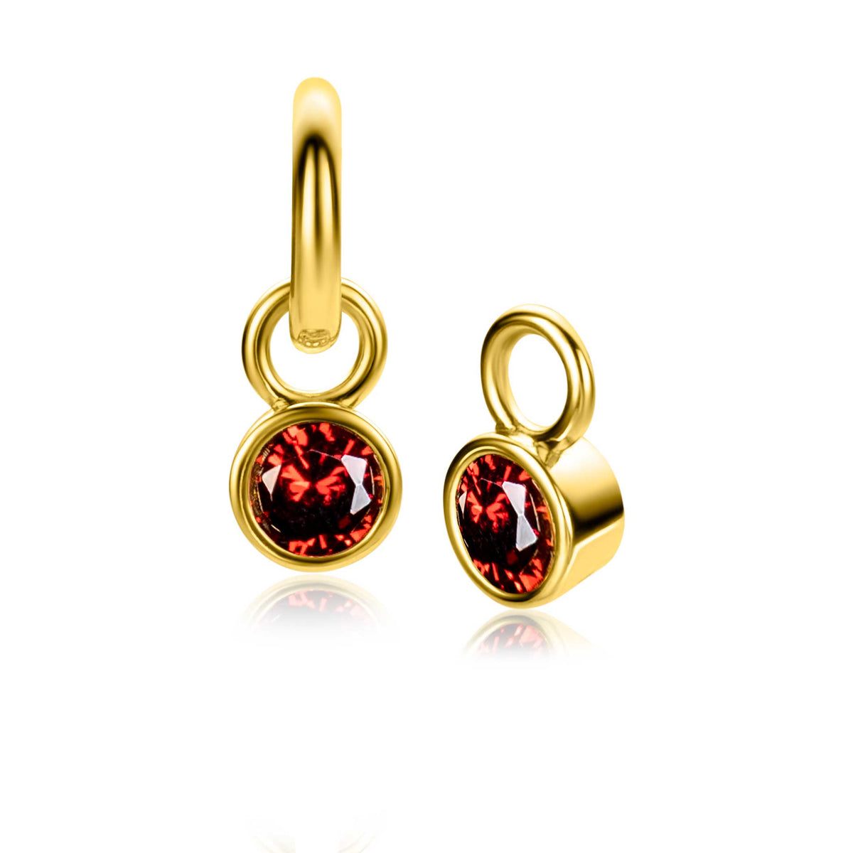 Boucles d'oreilles dorées avec un cristal rouge brillant.