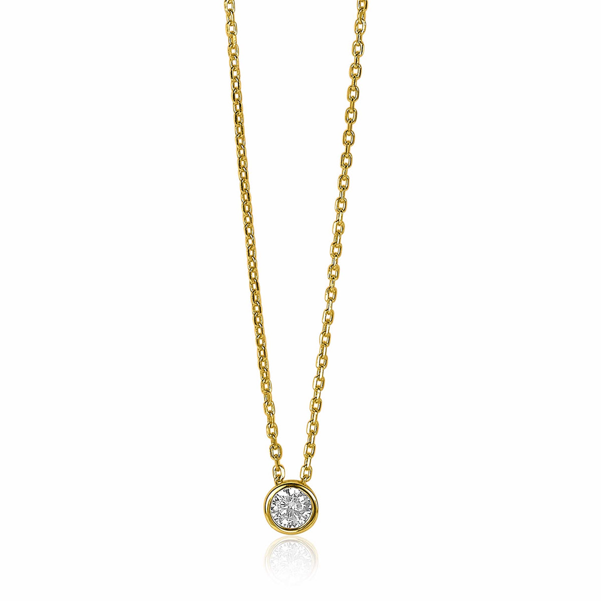 Collier doré avec un pendentif rond orné de pierres brillantes.