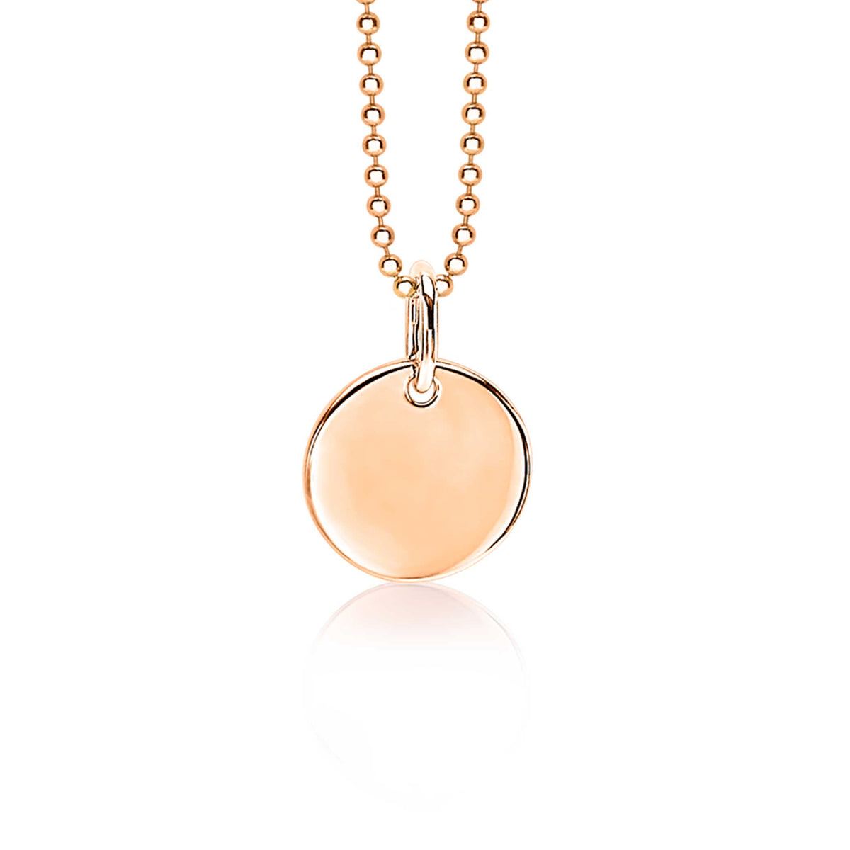 Pendentif rond en plaqué or, suspendu à une chaîne délicate.