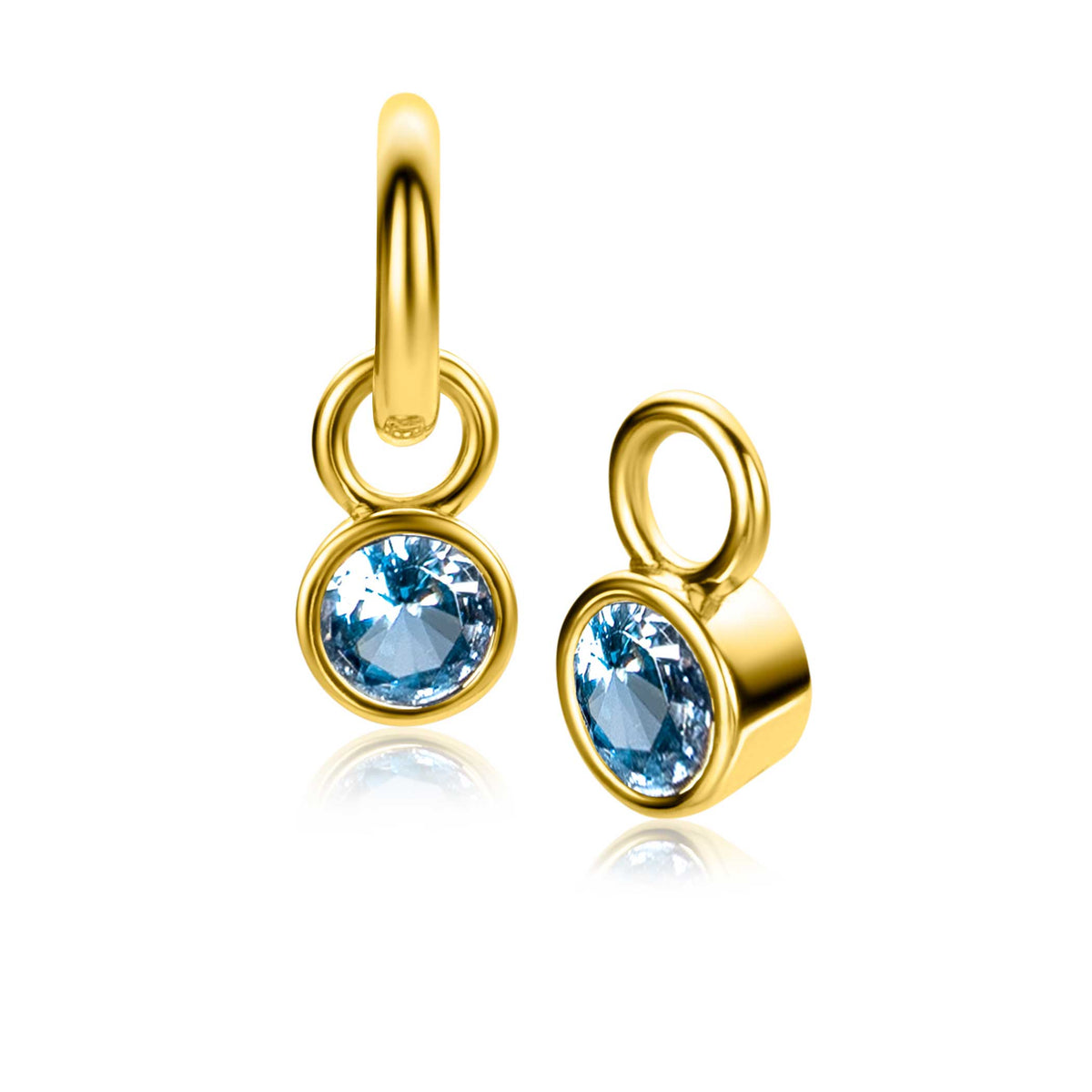 Boucles d'oreilles en plaqué or avec un cristal bleu, forme ronde et design délicat.