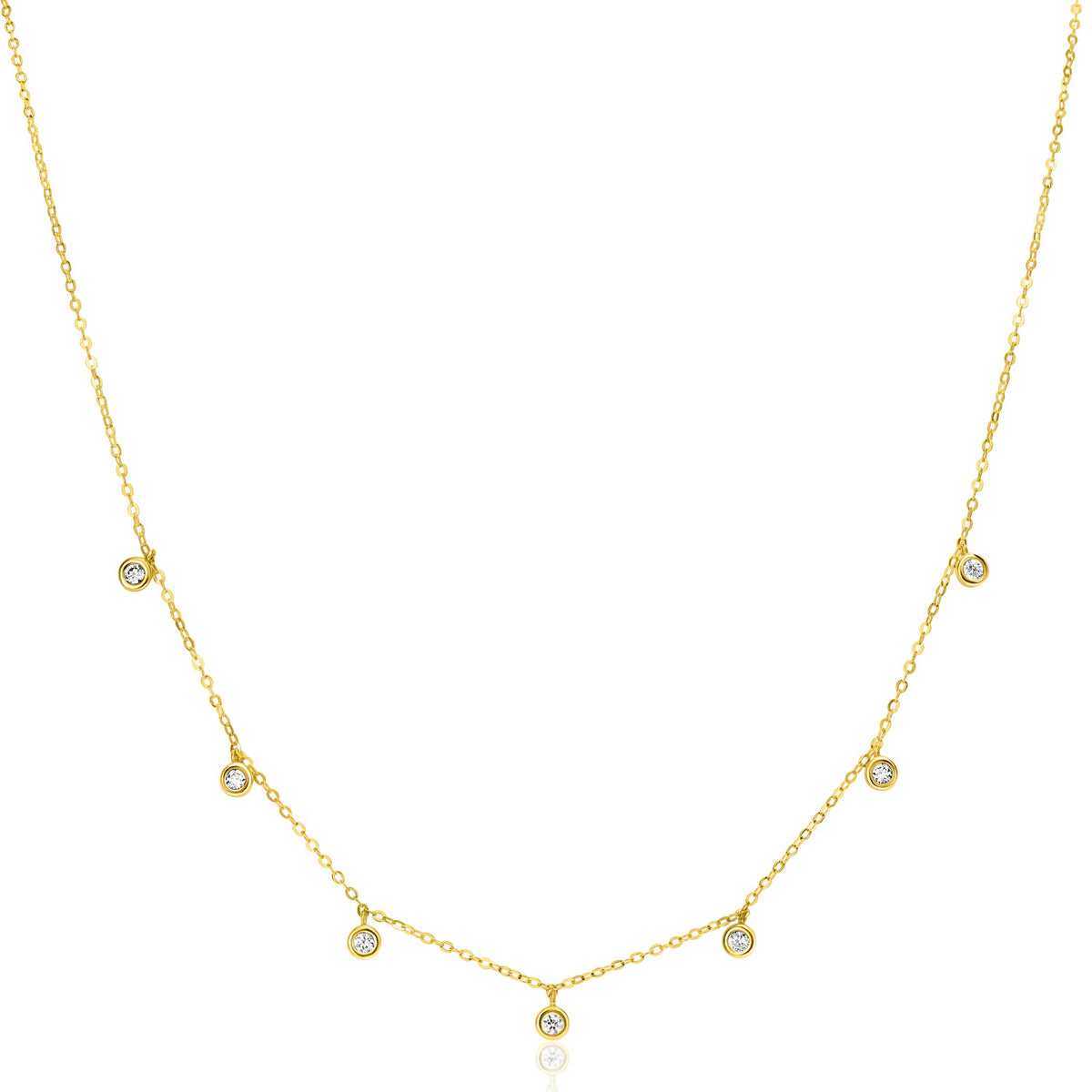 Collier doré avec des pendentifs ronds et brillants.