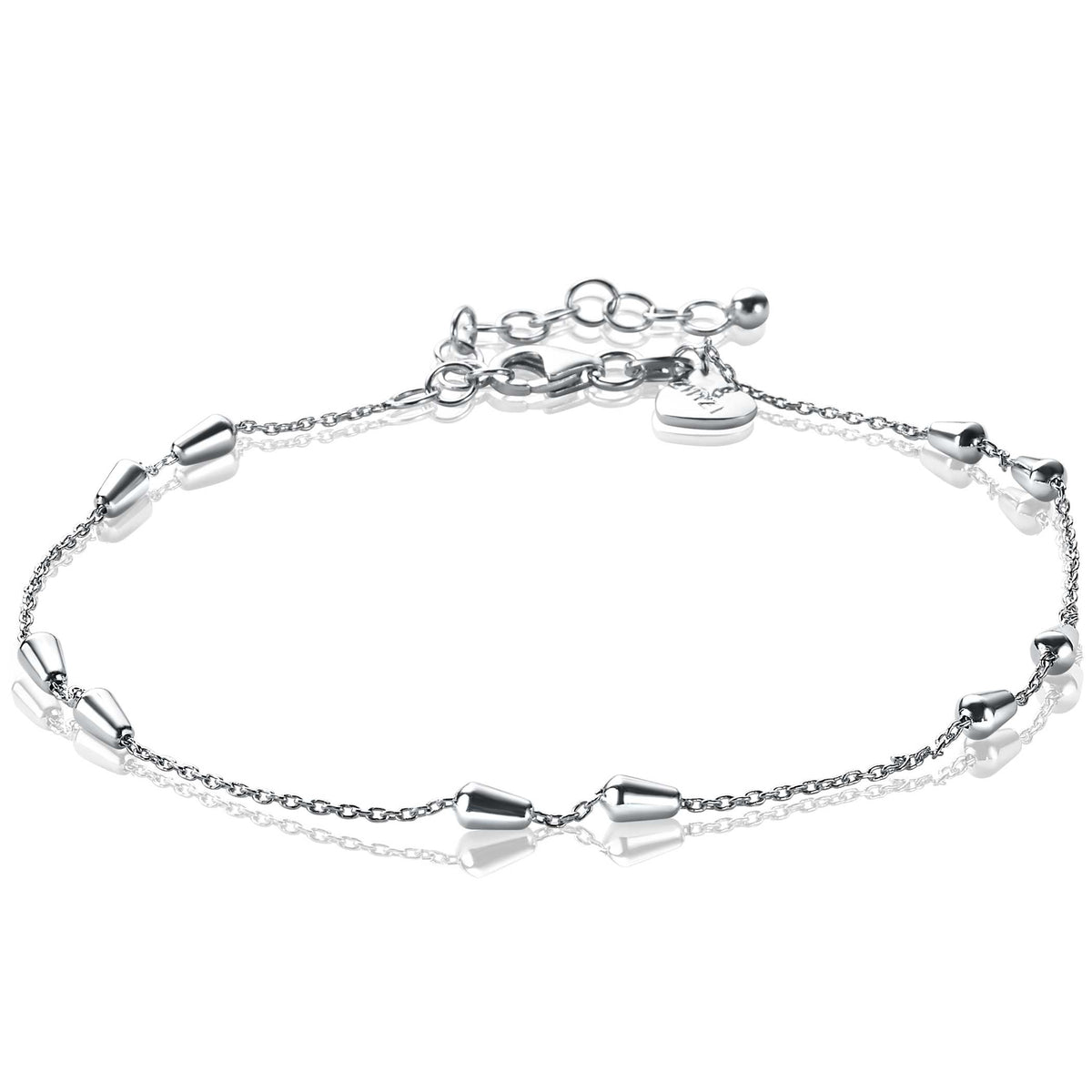 Collier en argent avec des éléments en forme de cône et une chaîne délicate.