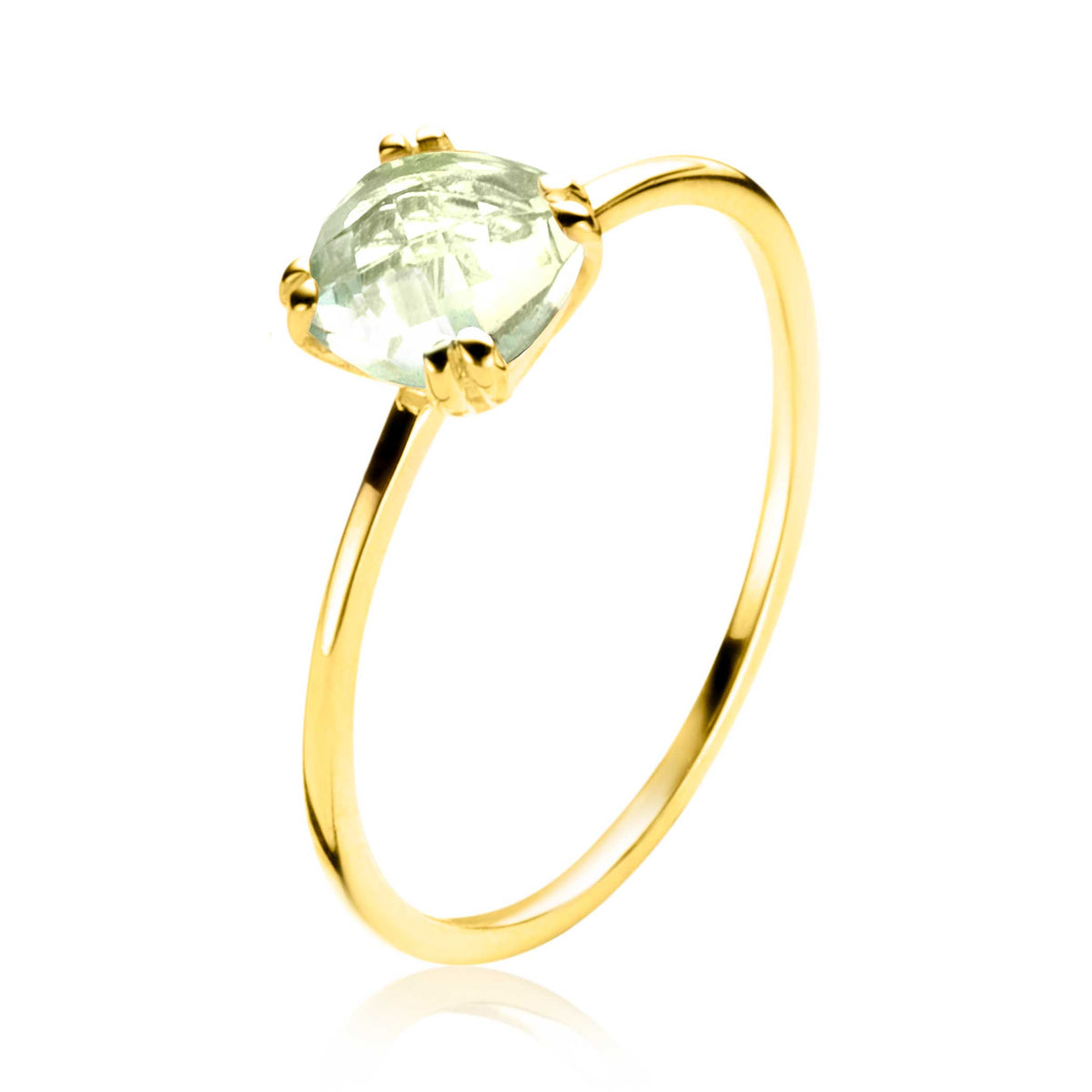Bague en or avec une pierre ovale transparente sertie.