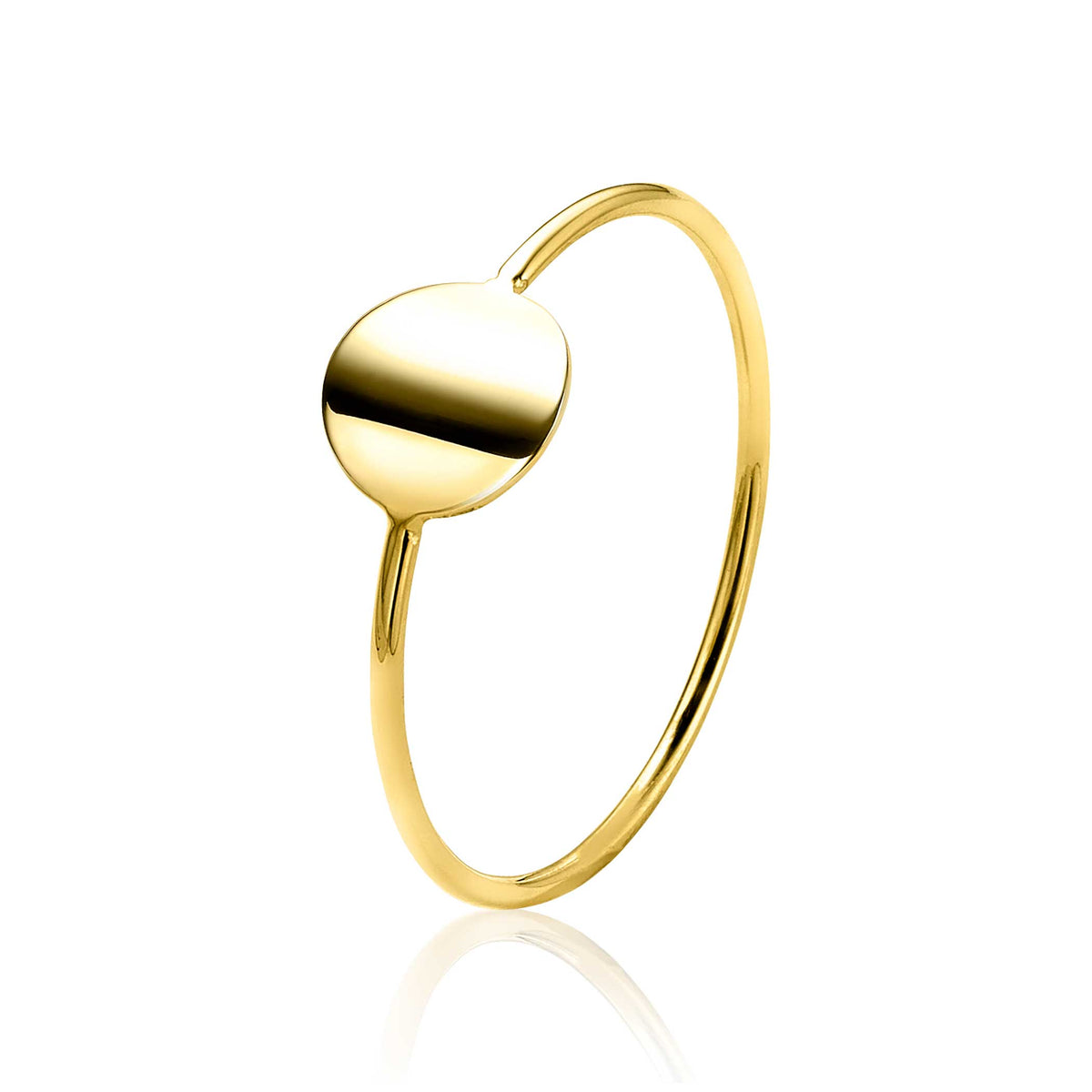 Bague en or avec un design minimaliste et un motif rond au centre.