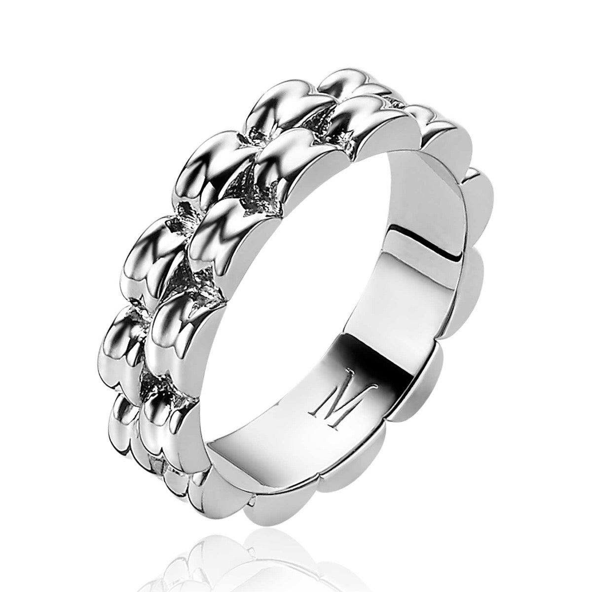 Bague en argent avec un motif ondulé et des détails brillants.