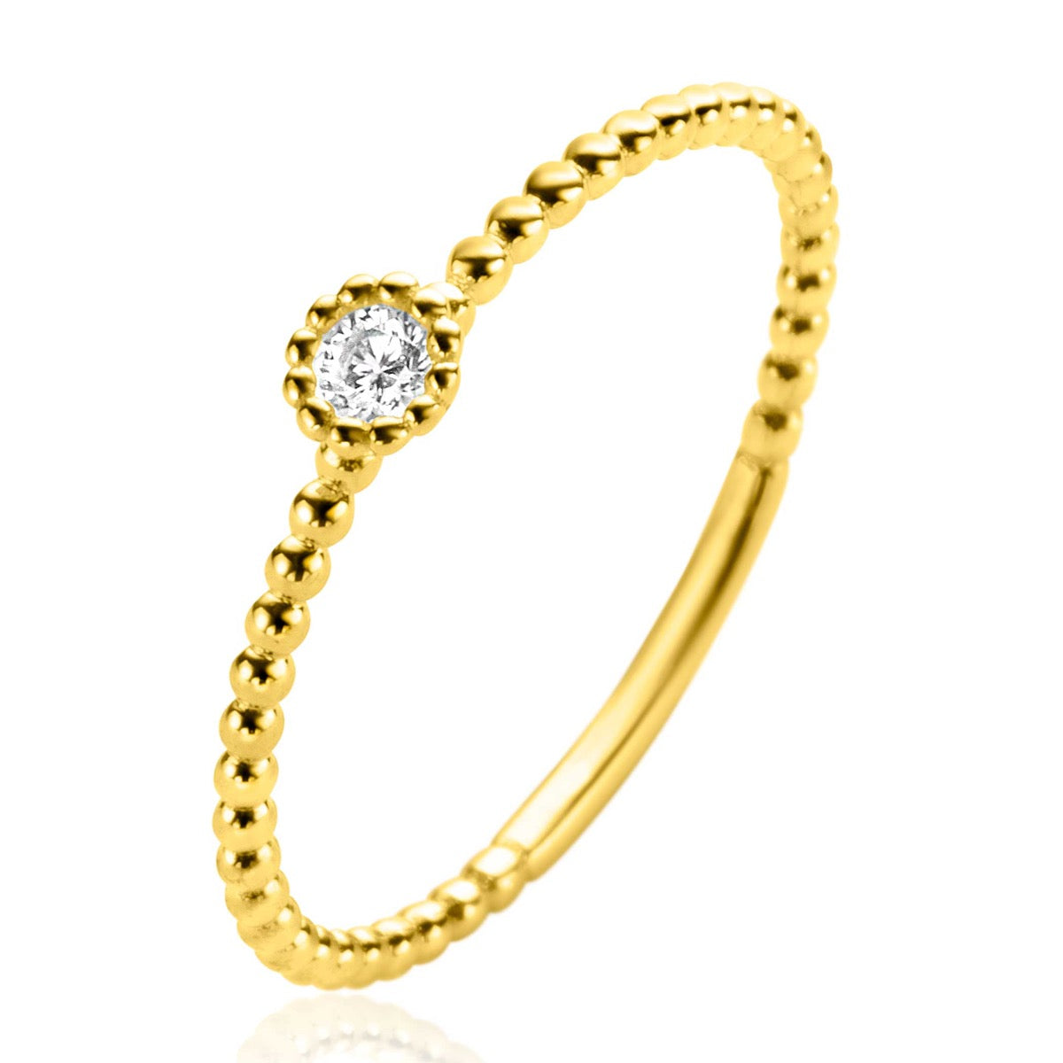 Bague en or avec un petit diamant central et un motif de perles.