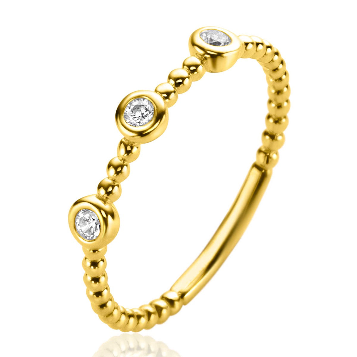 Bague en or avec trois pierres brillantes et un design à perles.