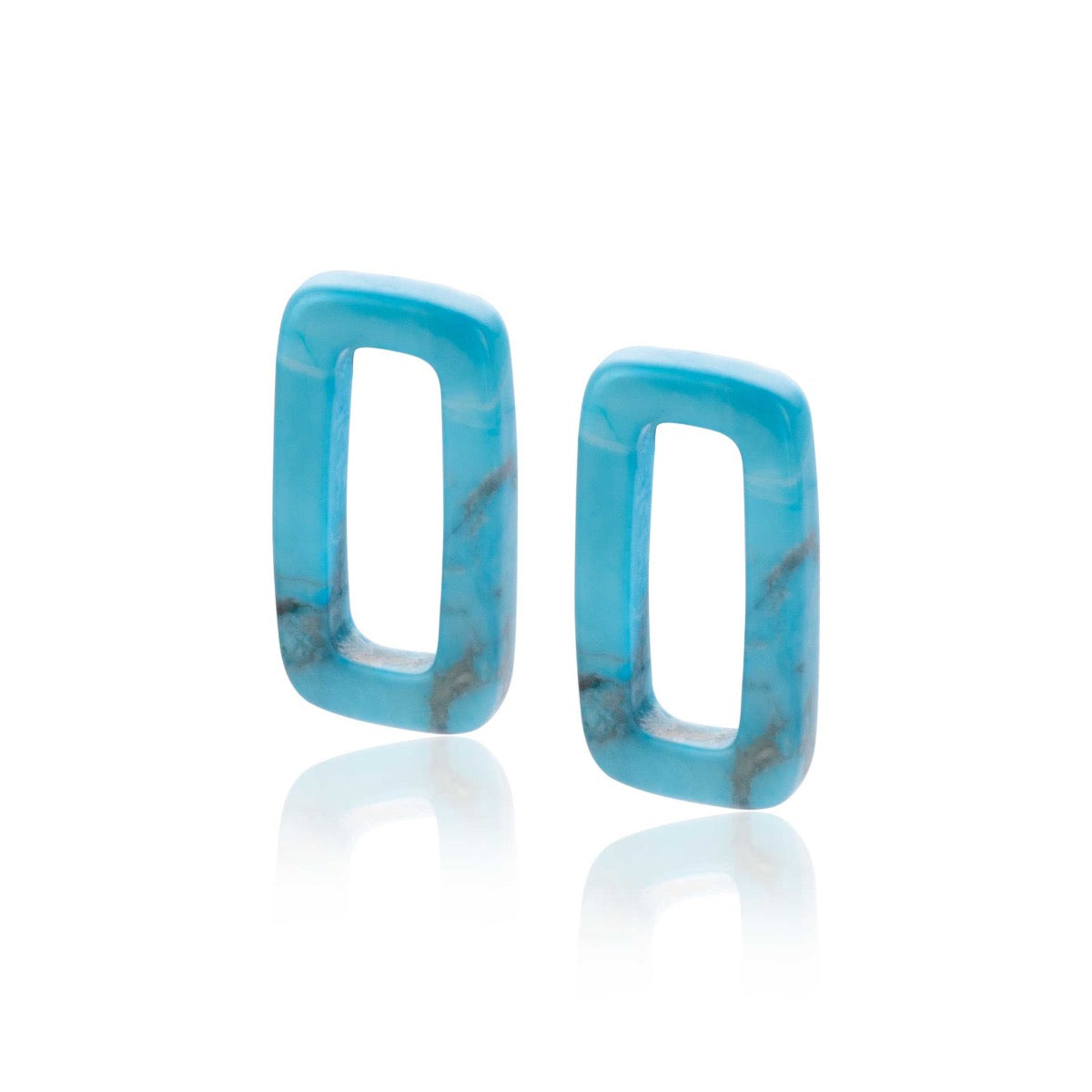 Boucles d'oreilles en résine turquoise avec une forme rectangulaire.