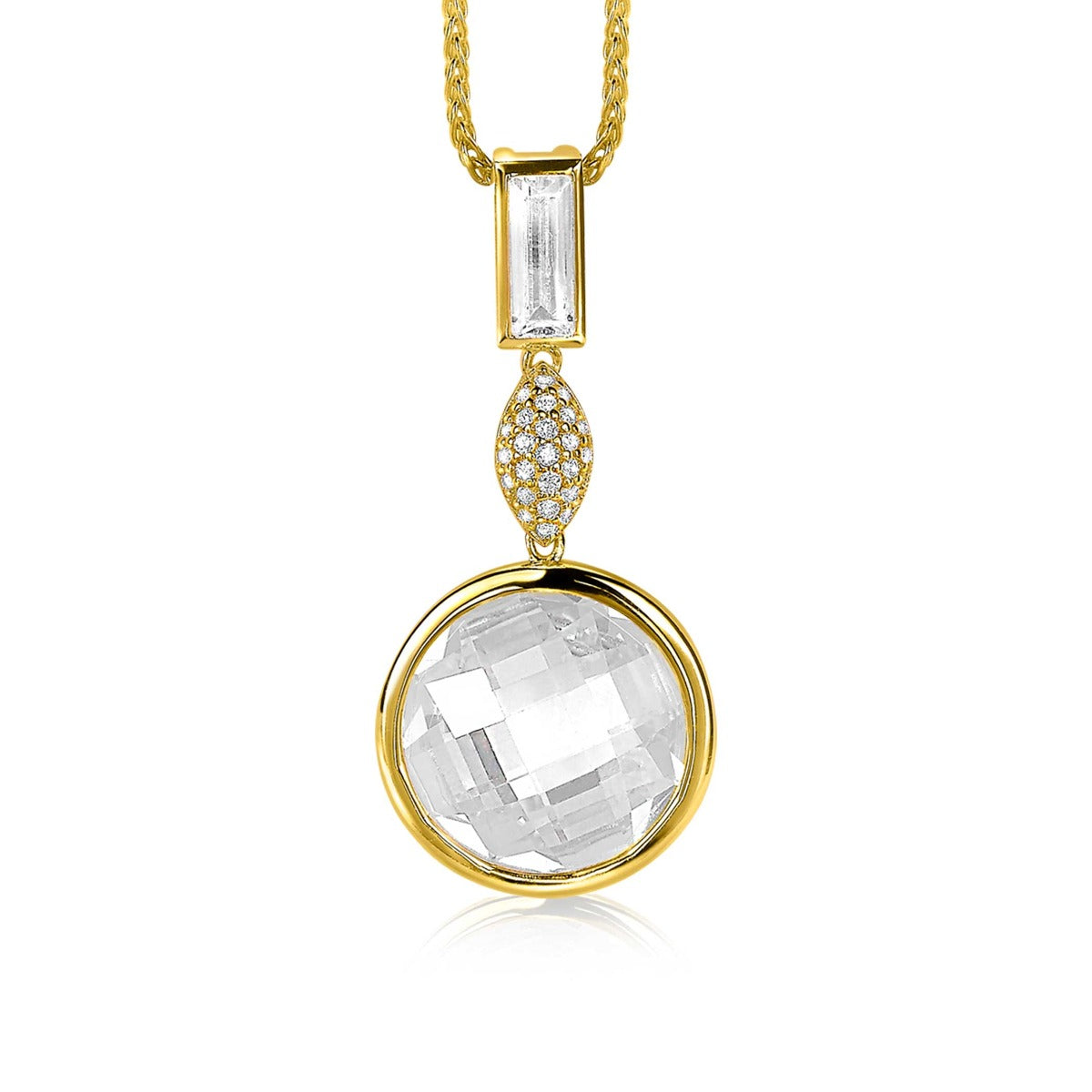 Pendentif doré avec un cristal transparent et des détails en strass.
