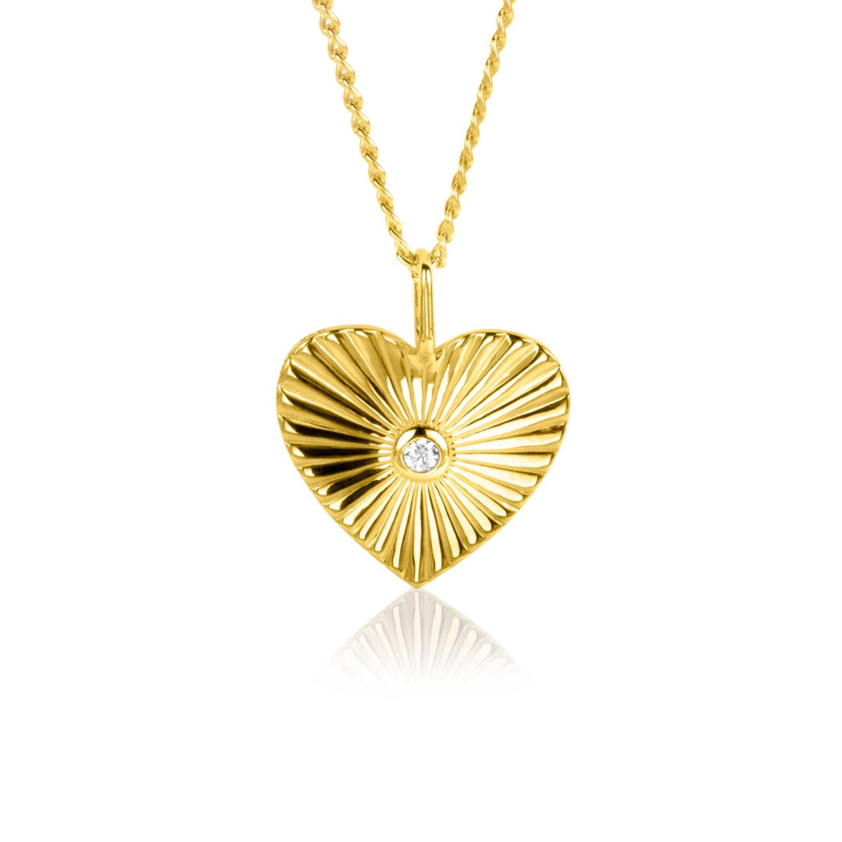 Pendentif en forme de cœur doré avec un motif rayonnant et un zircon au centre.