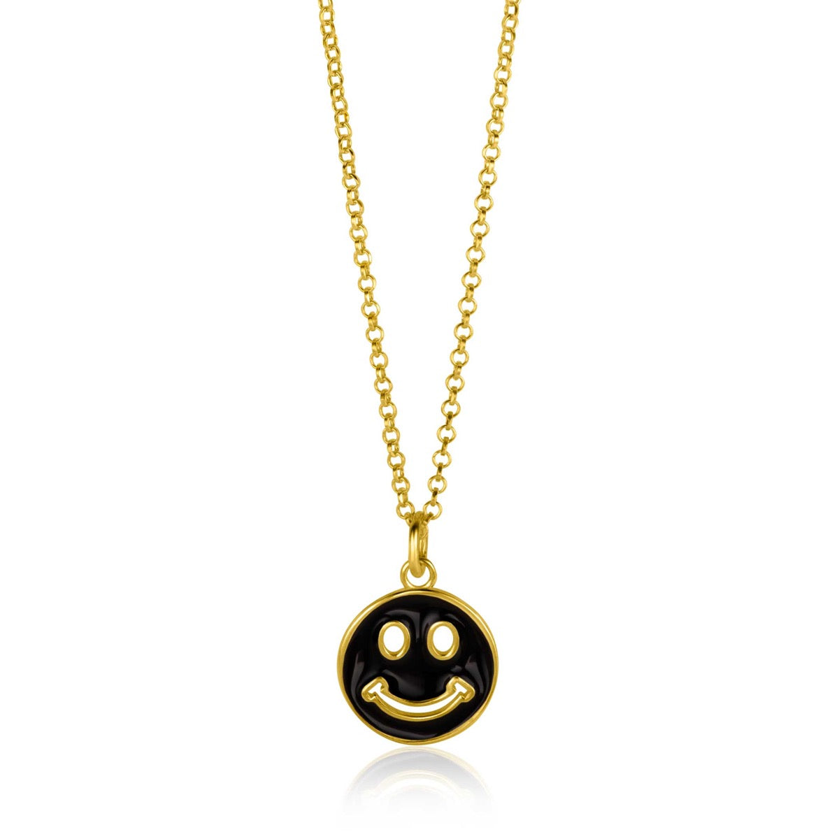 Pendentif en forme de smiley, doré, avec un fond noir, suspendu à une chaîne délicate.