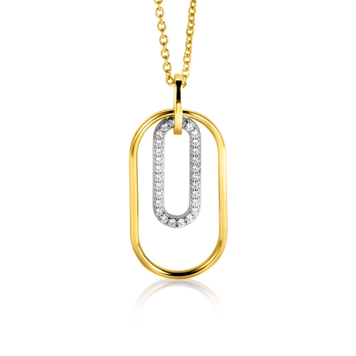 Pendentif en or doré avec un design ovale et un insert argenté orné de pierres brillantes.