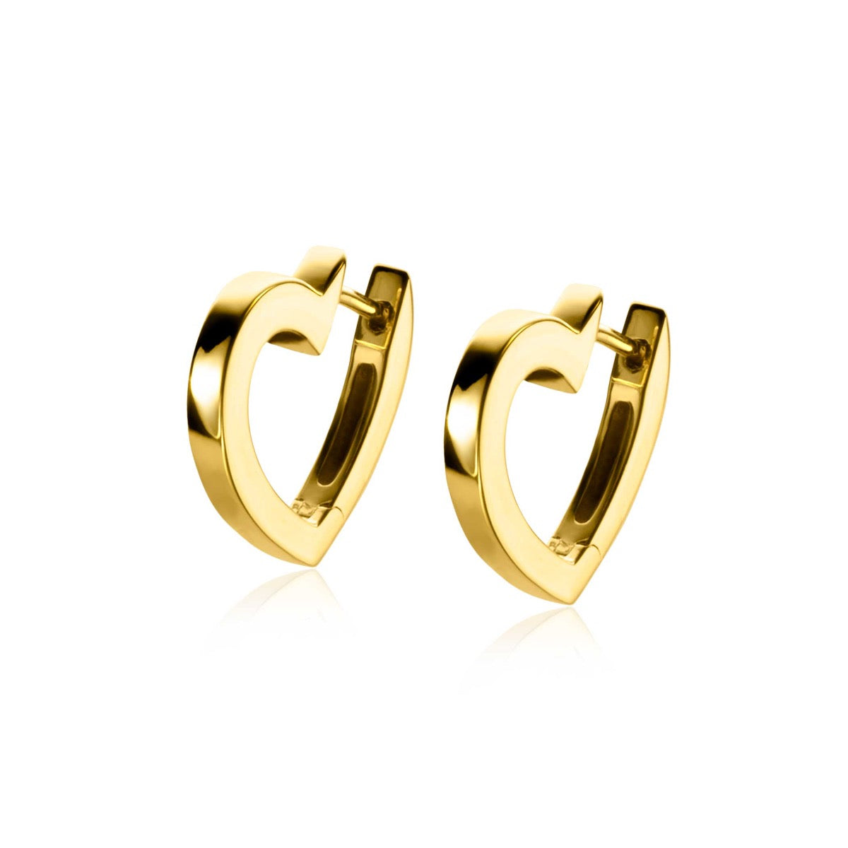Boucles d'oreilles en forme de cœur dorées.