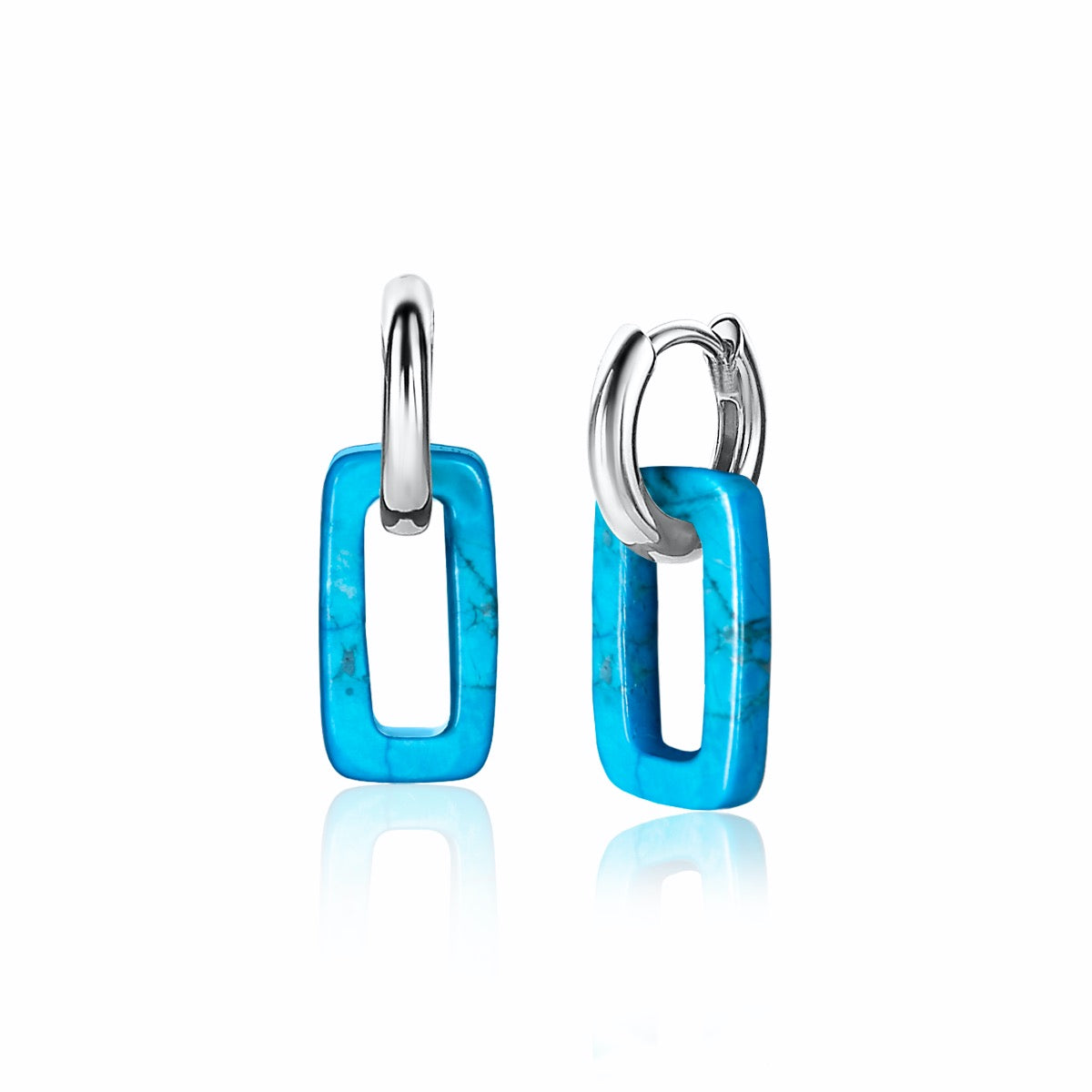 Boucles d'oreilles en argent avec des éléments en turquoise en forme rectangulaire.