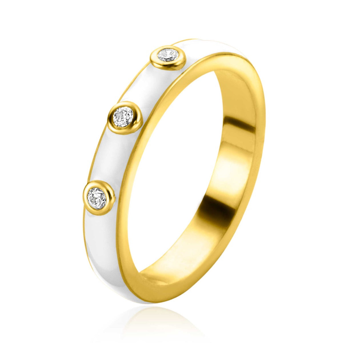 Bague dorée avec trois petites pierres brillantes et un motif blanc.